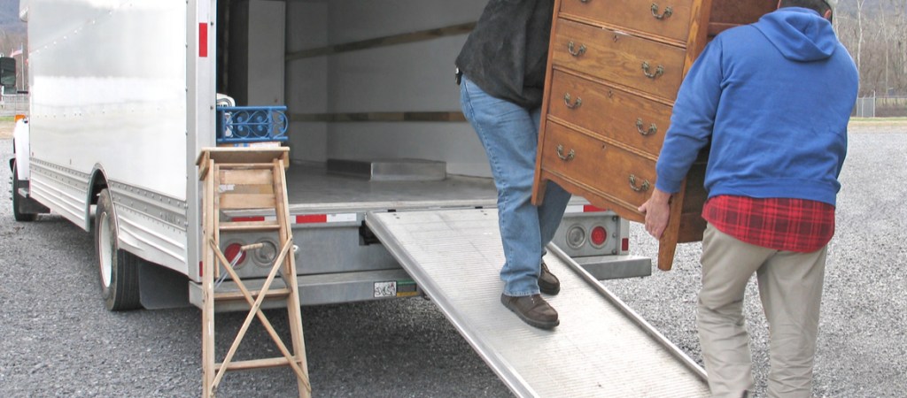 men loading furniture into a van