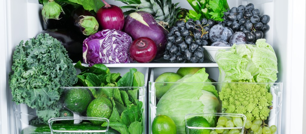fruits and vegetables in an organized fridge