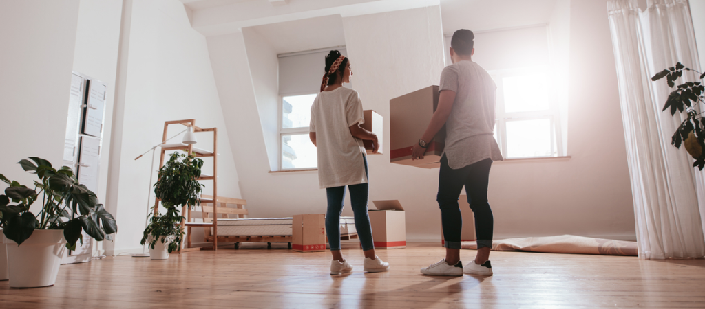 couple moving into light filled apartment