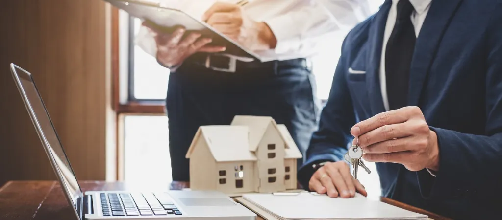 Real estate agent discussing house with client