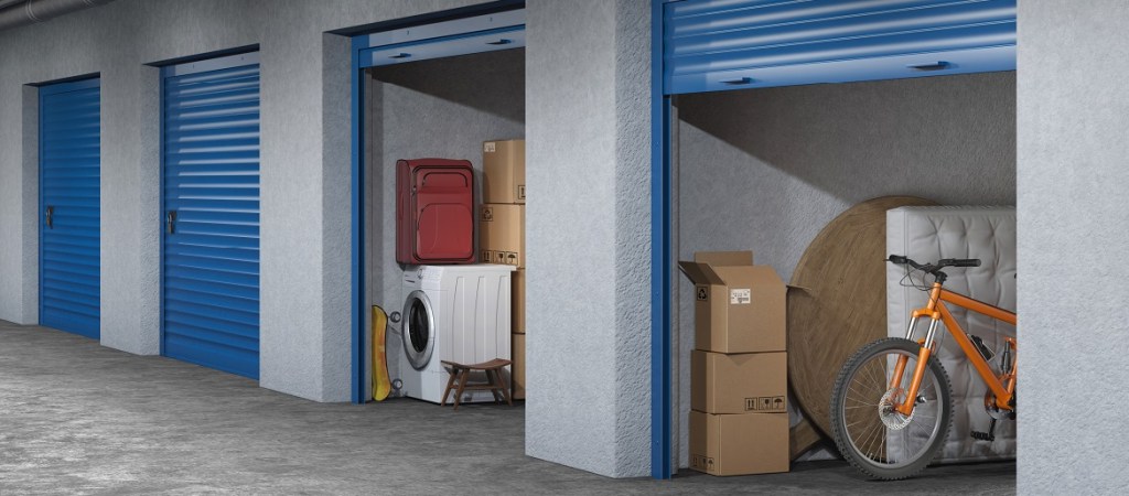 Self storage facility with doors open and stuff in units