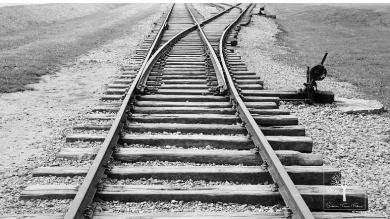 old railroad track with junction black and white
