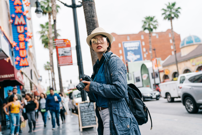 Traveler photographing city road in Hollywood Boulevard near the Wax Museum
