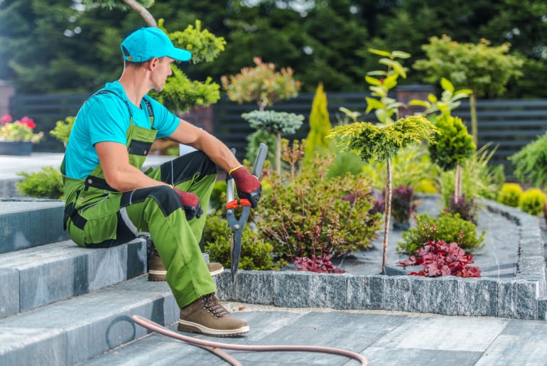 Professional Gardener in His 30s and His Newly Developed Residential Garden_ Landscaping Industry.