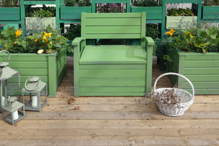 Backyard Wooden Patio Designed Surface. Landscaped Garden with Wooden Elements.