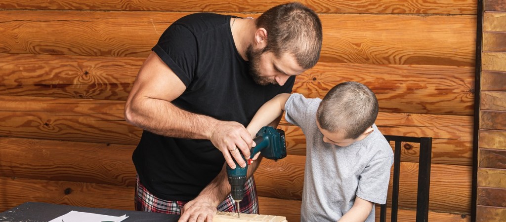 Father and son building from a kit