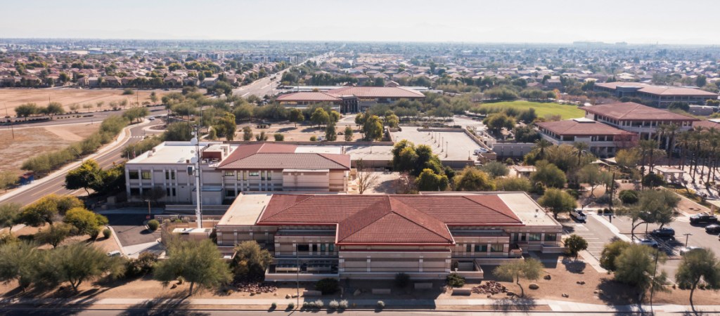 Afternoon aerial view of the downtown skyline and surrounding housing of Peoria, Arizona