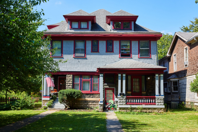 Classic blue house with red trim in suburban Indianapolis