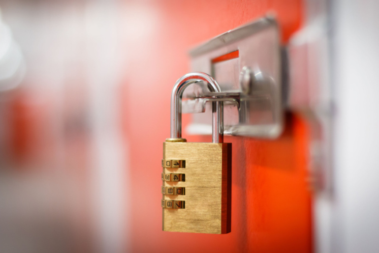 Gold padlock with code to secure storage