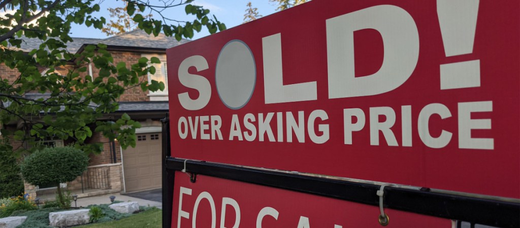 home with sold sign