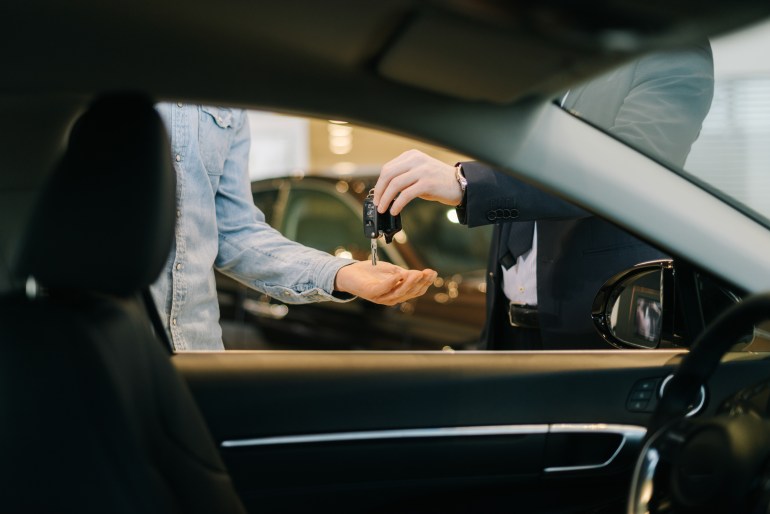 handing over keys on delivery of car