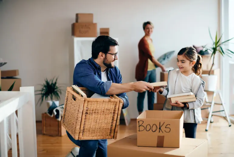 Family organizing their books