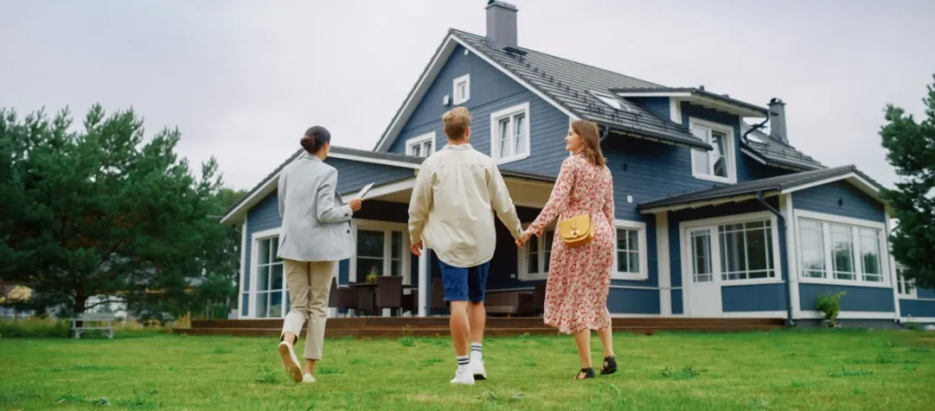 Couple and realtor visiting home for sale