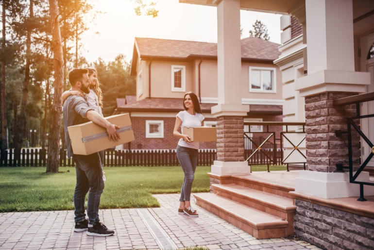 Young couple moving into a new home