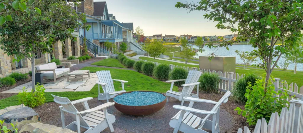 Outdoor patio of a house with fire glass on a fire pit in the suburbs