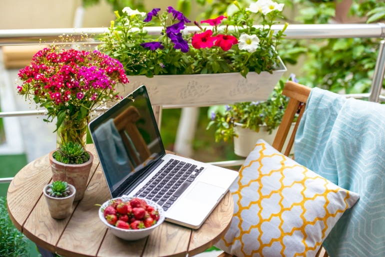 workspace with laptop on balcony