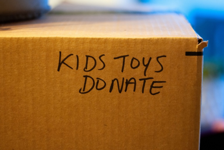 box with kids toys donate written on it