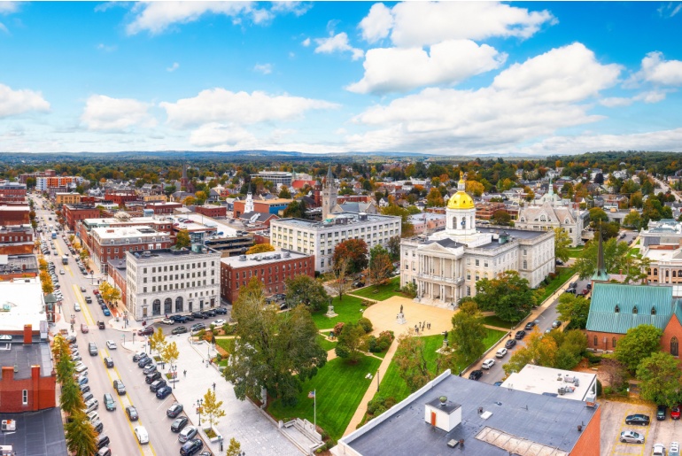 Aerial panorama of Concord and the New Hampshire State House along Main Street.