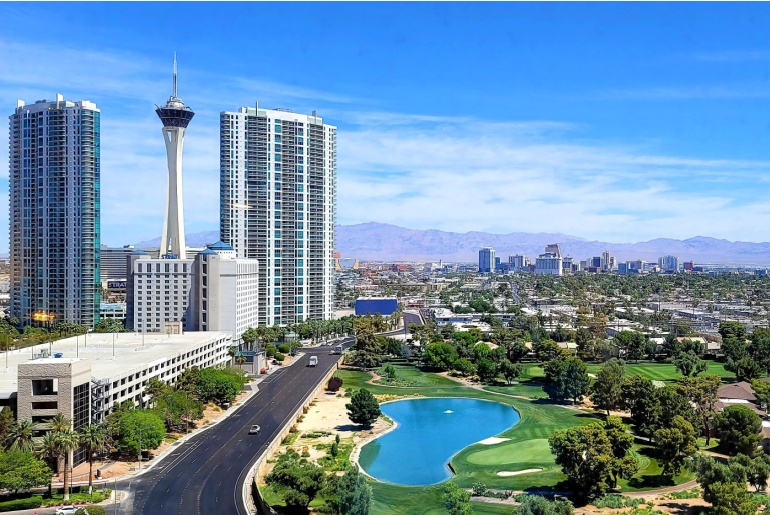 Panoramic shot of Las Vegas skyline with view of park in the daytime.