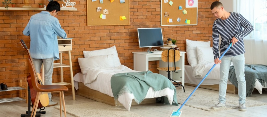 College students cleaning their dorm room