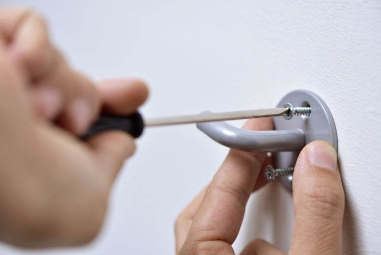 Hook screwed onto wall.