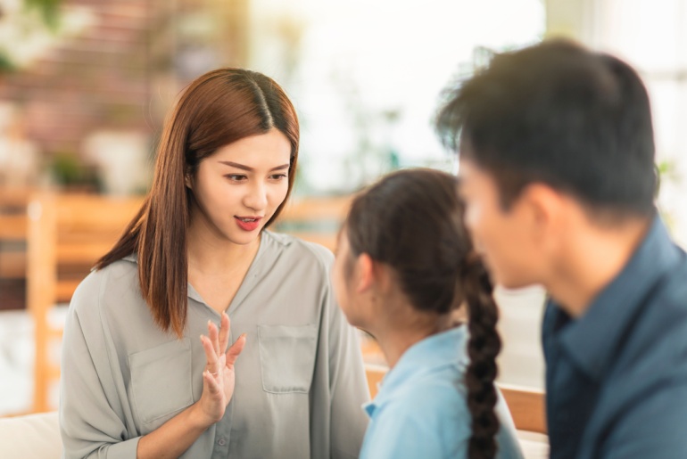 Mother-having-serious-conversation-with-daughter-at-home