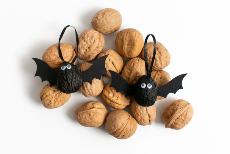 Bat decoration made out of walnuts.