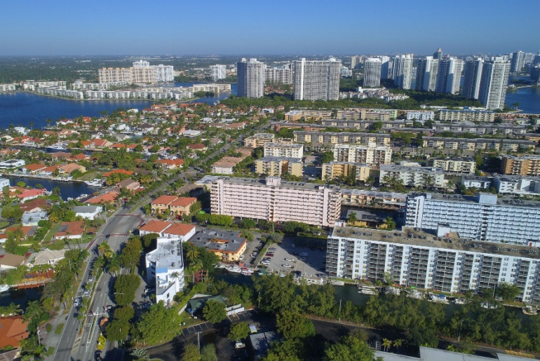 Overview of Miami, FL, with residential buildings in the forefront