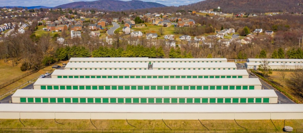 Aerial-view-of-self-storage-facilities-with-town-in-the-background
