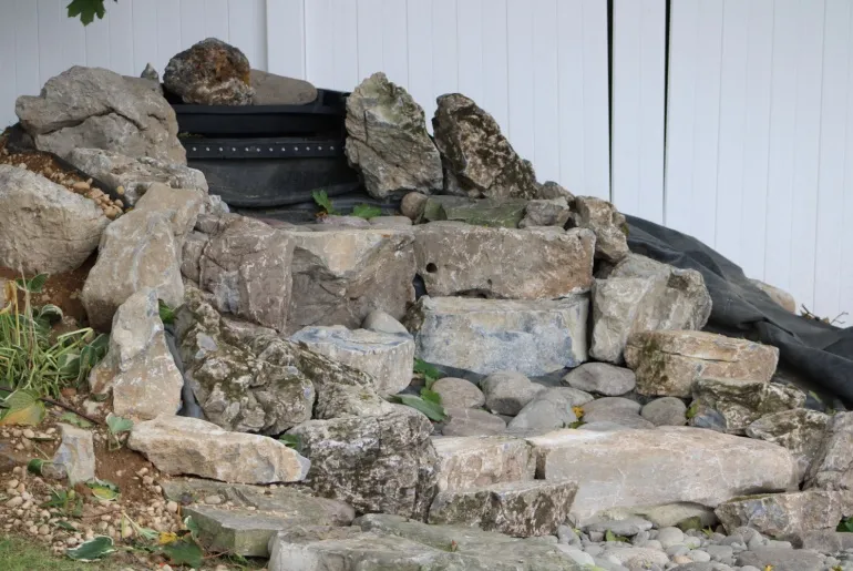 Backyard pondless waterfall that is being installed