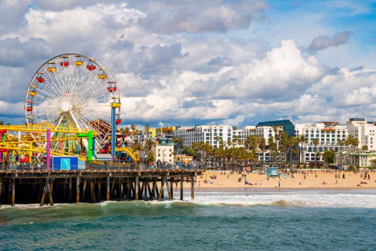 Santa Monica pier amusement park and beach panorama in LA, CA