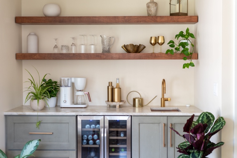 Stylish kitchen wet bar with floating shelves