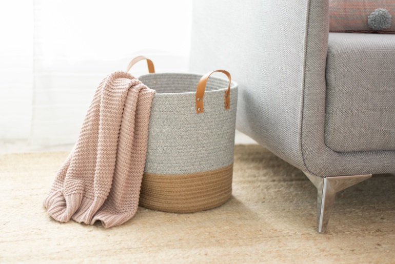 Woven basket in a minimalist home. Action basket for minimalist organization.