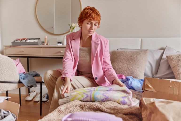 woman changes her wardrobe with the seasons