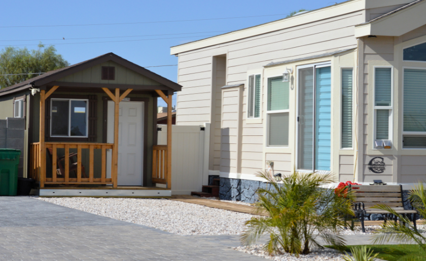 Accessory Dwelling Unit built near tiny home. ADU shed near micro-home on small city lot.
