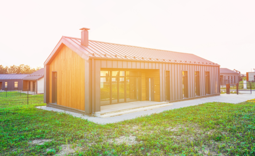 Modern barndominium at sunset
