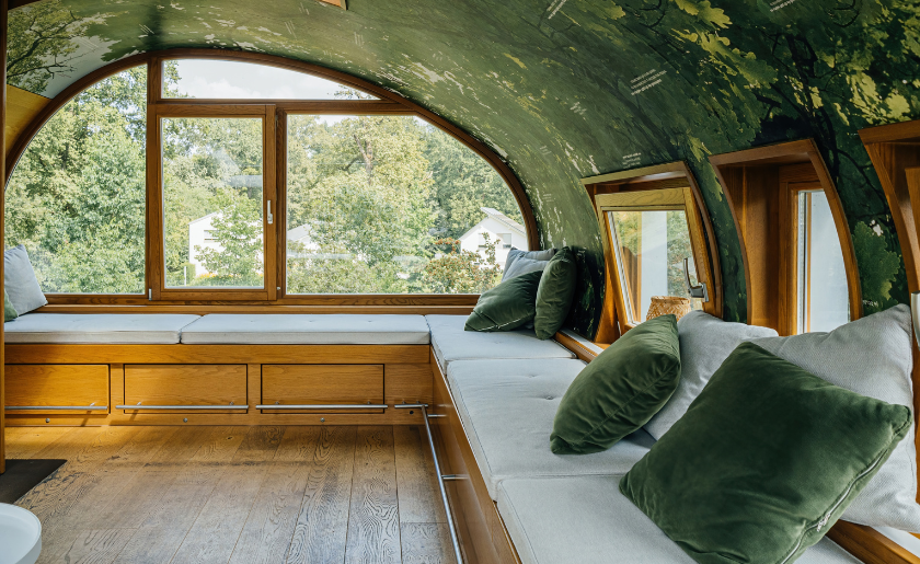 Modern treehouse interior with large windows