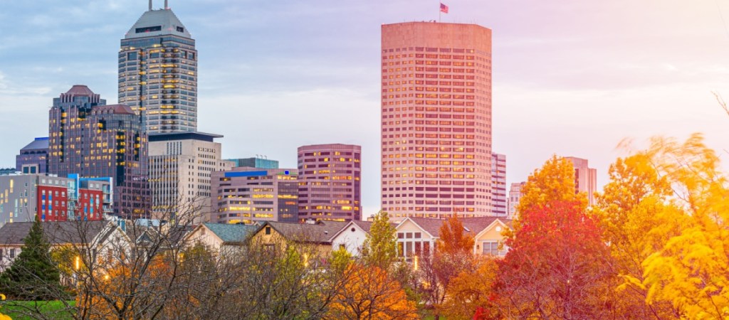 Indianapolis, Indiana, USA river walk and skyline at dusk in the evening.