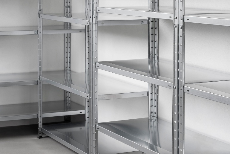 Modern storage room with empty metal shelving unit