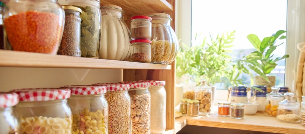 interior of pantry with jars on shelves