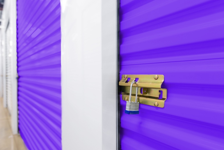 Key lock securing door on self storage unit.