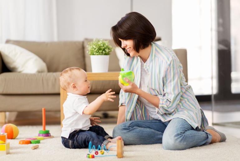 Baby playing with their mom