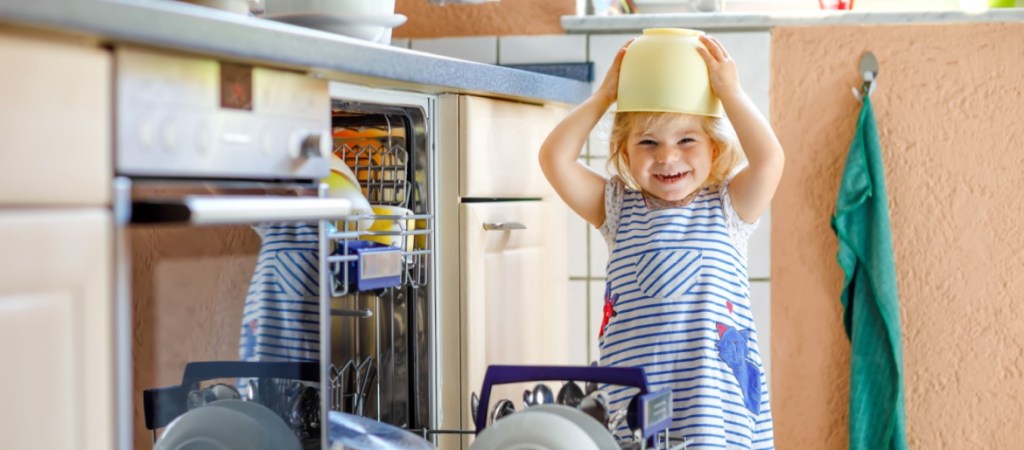 toddler playing in kitchen