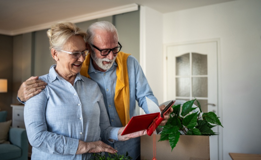 old couple sorting possessions