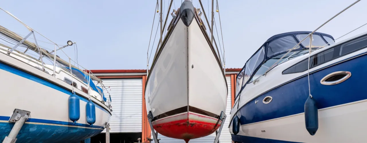 Boat storage. Boats in front of large self storage units.