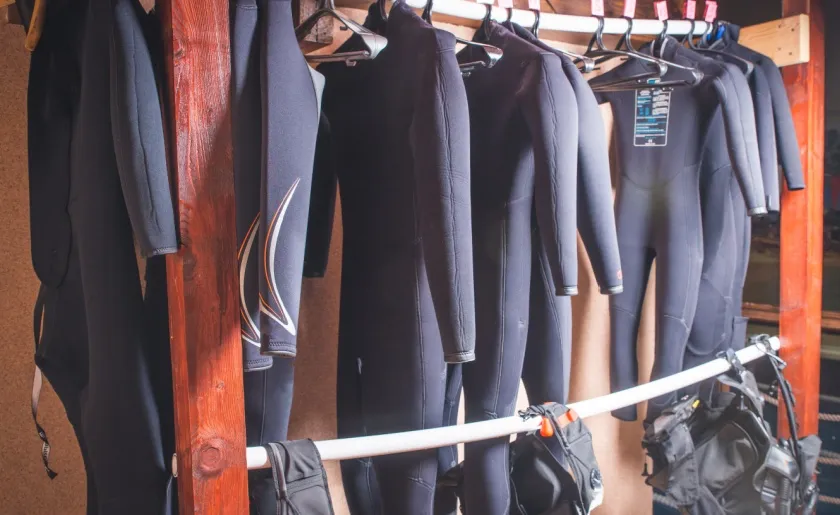 Diving-equipment-hanging-from-racks