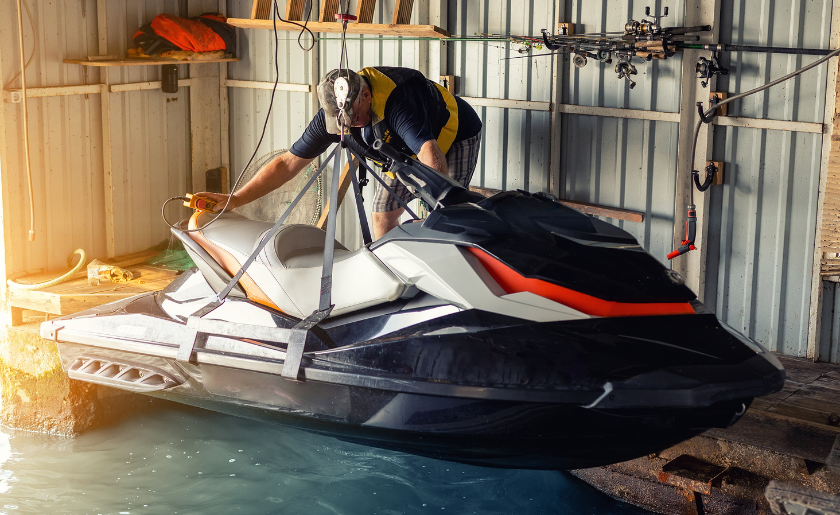 Indoor jet ski on water, with dry-stack storage.