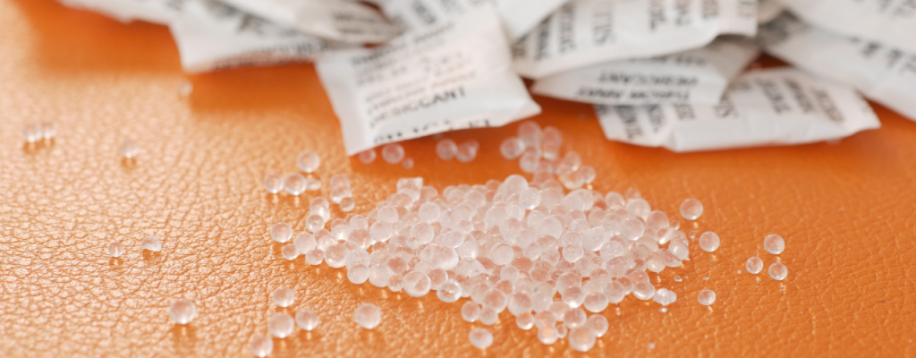 Silica gel packets. Silica gel beads on table.