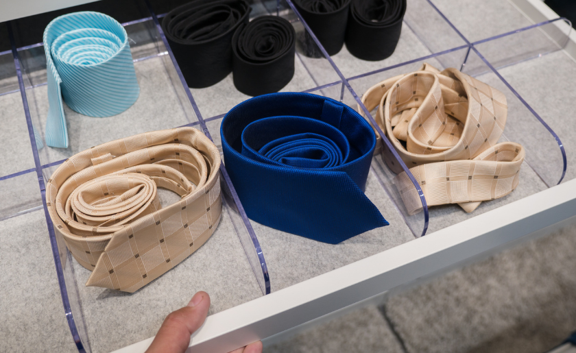Ties stored in drawer with plastic dividers