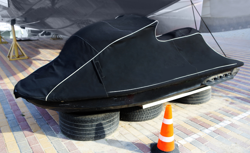 Jet ski covered with an awning, in preparation for winter storage.